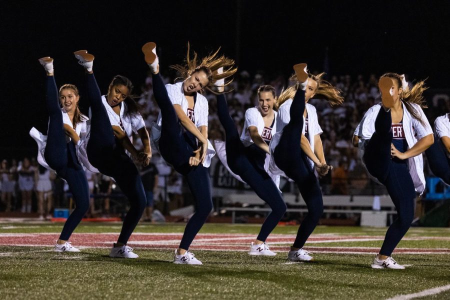 Serena Bartels (third from right) and members of the dance team perform at halftime. Bartels is one of the teams senior members