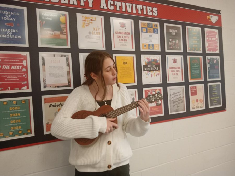 Abby Brown practices with her ukulele.