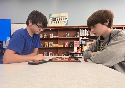 Will Rentfro and Carson Hack play checkers in the library Soar Time. 