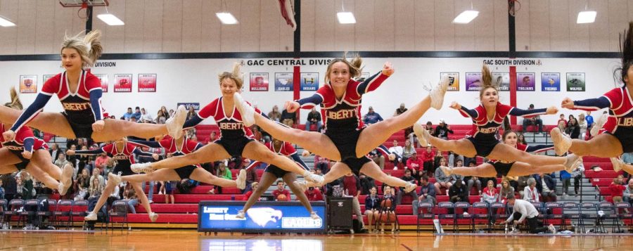 During varsity boys halftime game against Timberland on Nov. 22, cheer performed their routine. 