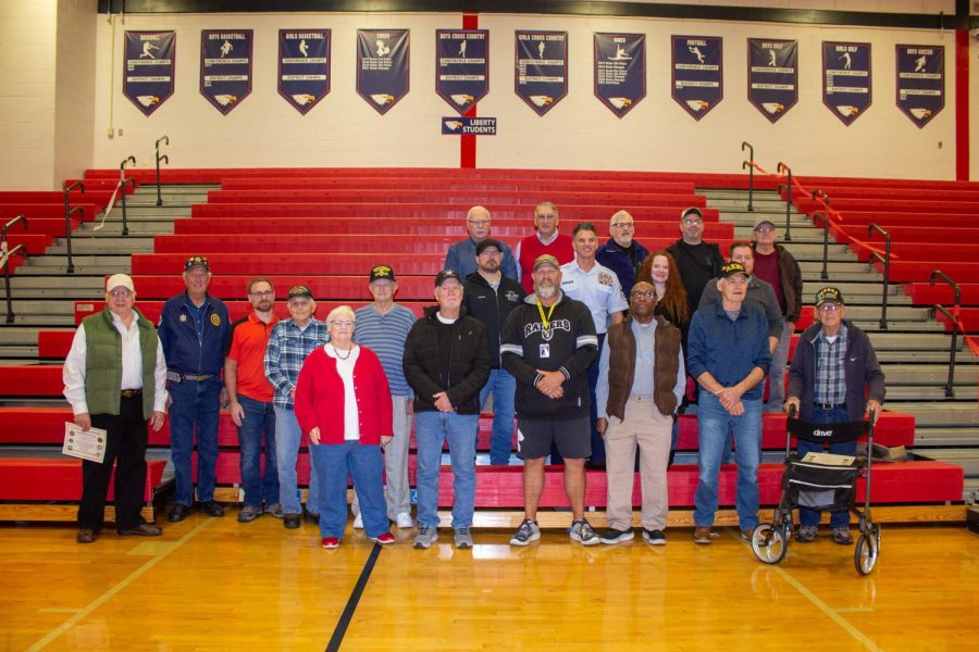 Veterans gather together for a group picture 