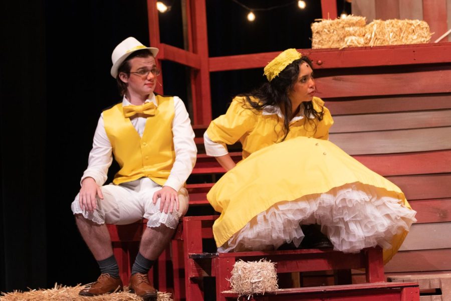 Tyler Bugg and Madeline Claravall look at Sheep and Lamb in Charlottes Web.