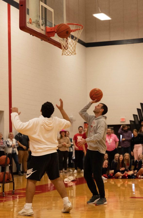 (Left to Right) Freshman Jawad Aarda and Mr. Walterbach playing knockout at the pep assembly. 