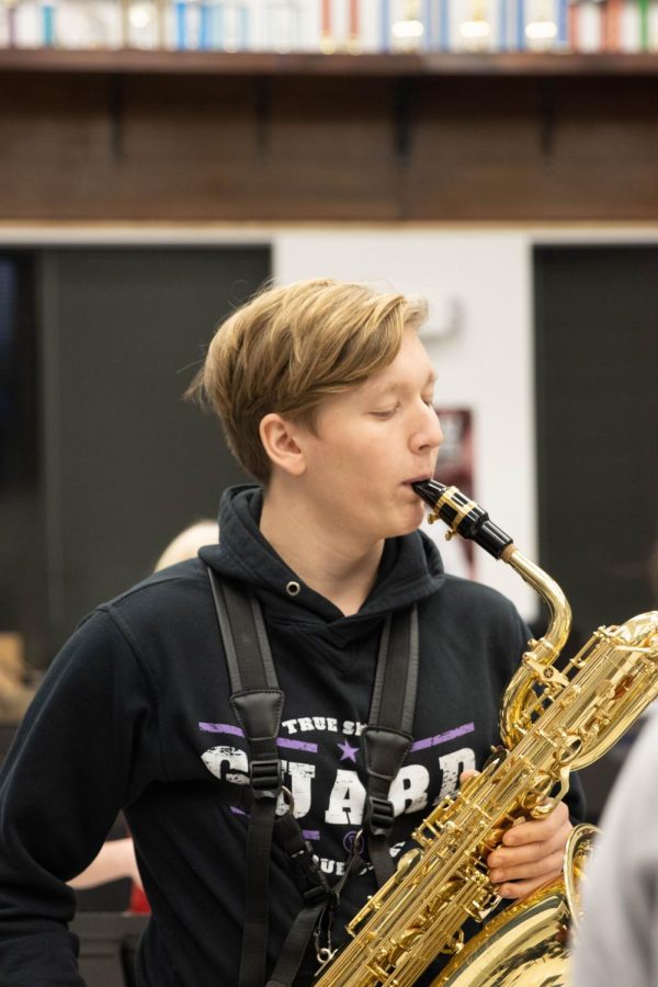 Ben Young practices with his baritone saxophone.
