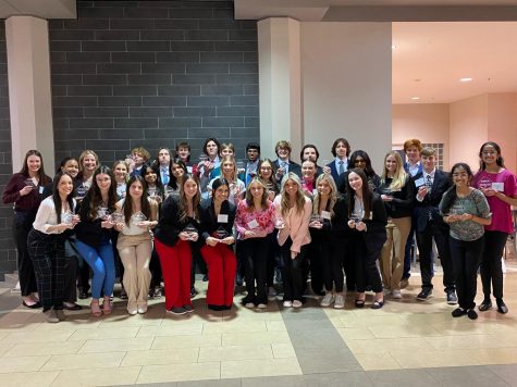 Libertys DECA members pose with their awards at the DECA districts. 