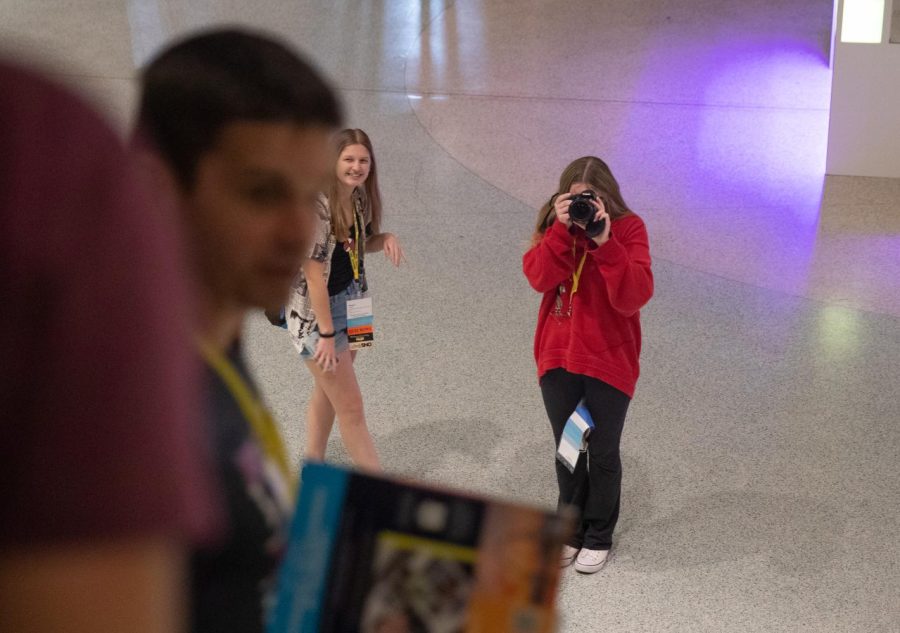 Sydney Davis (11) takes a photo of publications adviser, Mr. Hall, at the 2023 JEA/NSPA National Journalism Conference in St. Louis, Mo. 