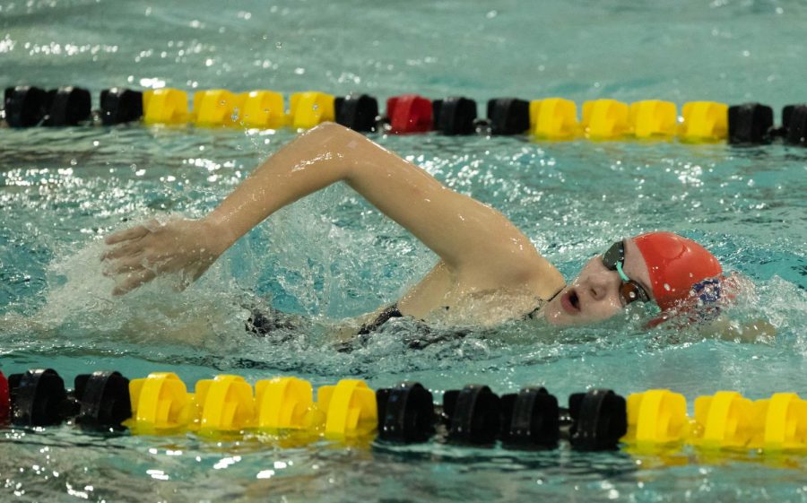 Nolan swims freestyle at the first meet of the High School season.