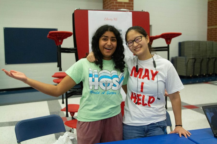 Emma Thomas (11) and Sophia Fiorino (12) pose for a photo during 8th grade night. Thomas and  Sophia Fiorino are both part of HOSA and Key Club. 