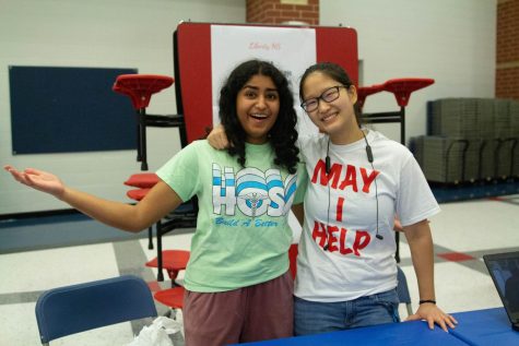 Emma Thomas (11) and Sophia Fiorino (12) pose for a photo during 8th grad engith. Thomas and Do are both part of HOSA and Key Club. 