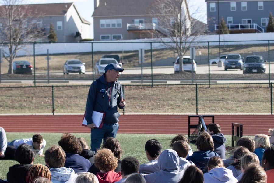 Track athletes listen as Coach Glavin gives a speech on the first day of spring sports practice on Feb. 27.