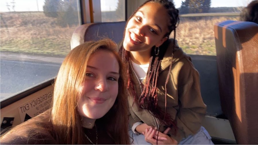 Emma Carter and Grayce Page take a moment for a quick photo while on the bus headed to Columbia. 