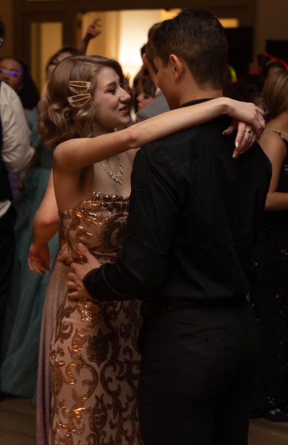 Samantha Carr dances with her date at prom.