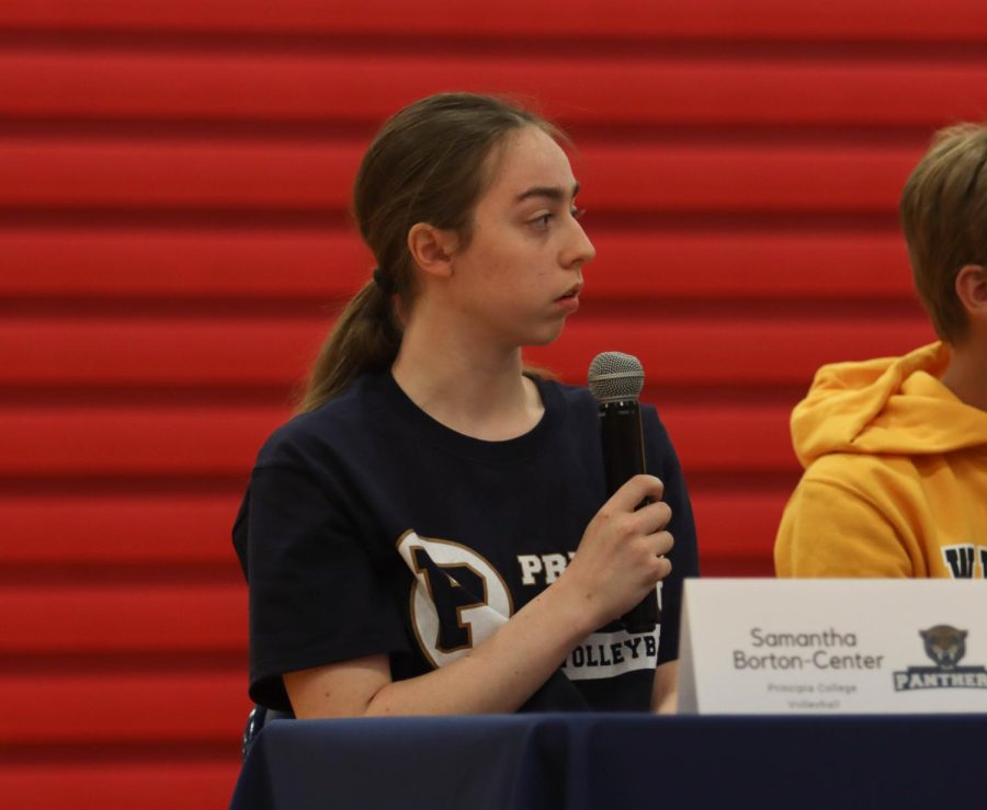 Samantha Borton-Center answers a question from Mr. Eldredge during the signing ceremony. 