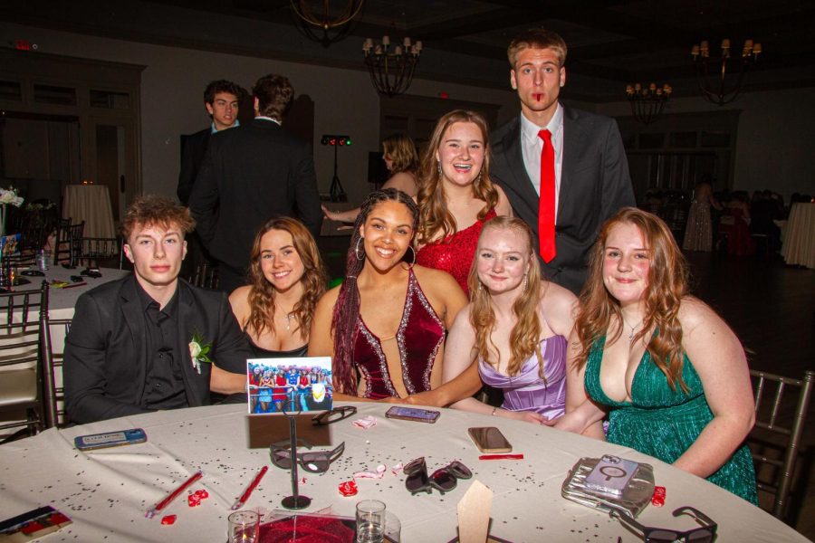 Sam Johnston, Hannah Barton, Grayce Page, Sabryn Gibson, Emma Carter, Kyndall Stubblefield and Will Thompson take a moment for a picture during prom.  