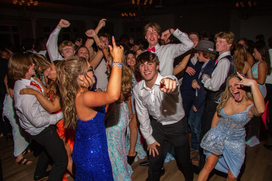 Students dance during a song at prom. 