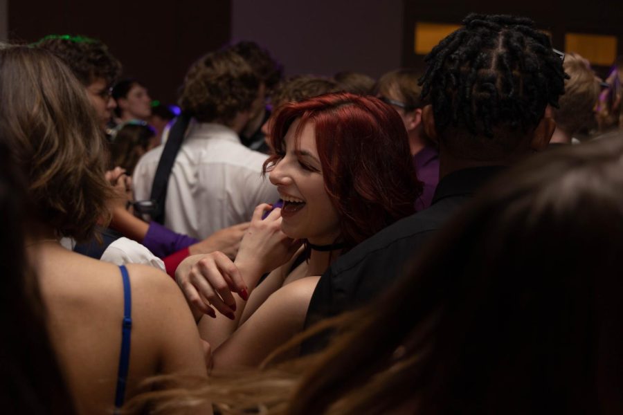 Julia Wiley laughs with friends during the dance. 