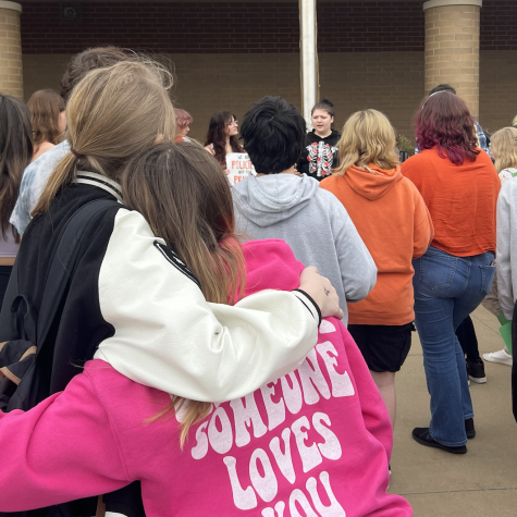 Students stand together during the walk-out to support each other.