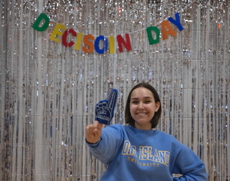 Morgan Feinstein (12) has committed to Long Island University, posing with a foam finger.