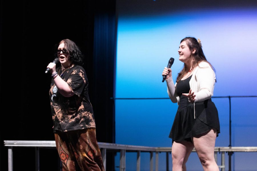 Seniors Madilynn Tiemann and Amanda Speciale perform a duet of the Dont Stop Believin parody.