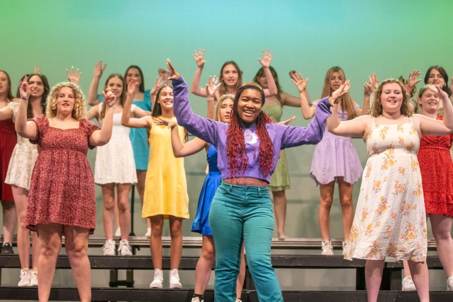 Senior Sarah Clay performing front and center during the group number Song of a Disney Hero.