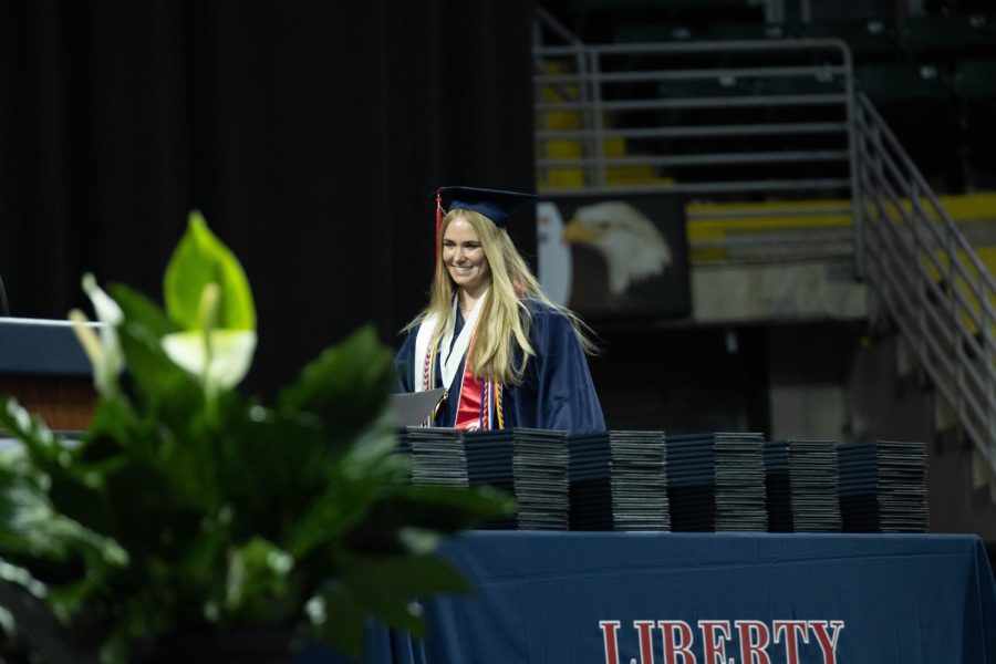 Audrey Fleetwood walks across the stage at the Family Arena after delivering the senior speaker speech. 