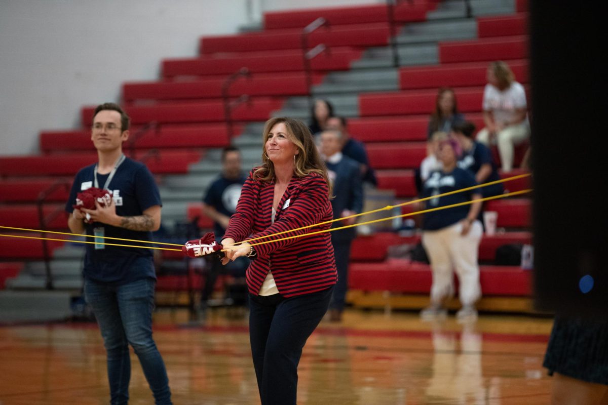 Dr. Danielle Tormala walks around Libertys gymnasium on Aug. 15, launching t-shirts into the stands at the Superintendents Welcome. This event served as Tormalas Welcome Back to School which presented staff with new expansions and enhancements to the Wentzville area that will benefit students.  
