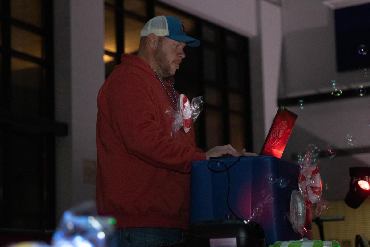 Mr. Wheeler serves as the DJ at many of the Liberty dances. Here, he works at the winter formal last year. 