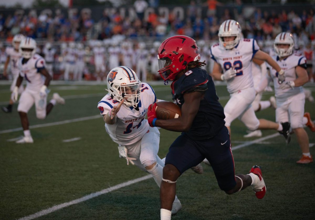Senior Marquis Williams makes a run with the ball during the first quarter home game on Sept. 8 against North Point. 