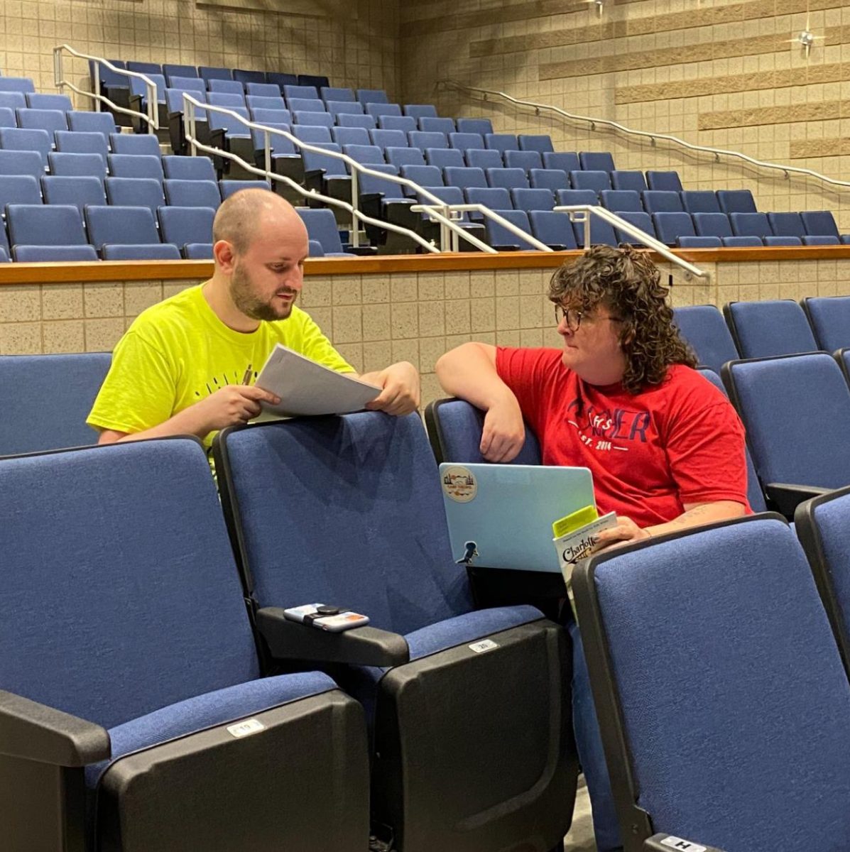 Mr. Eversole and Ms. Gehrke take a moment to discuss details in the play Charlottes Web that took place in the auditorium last year. 