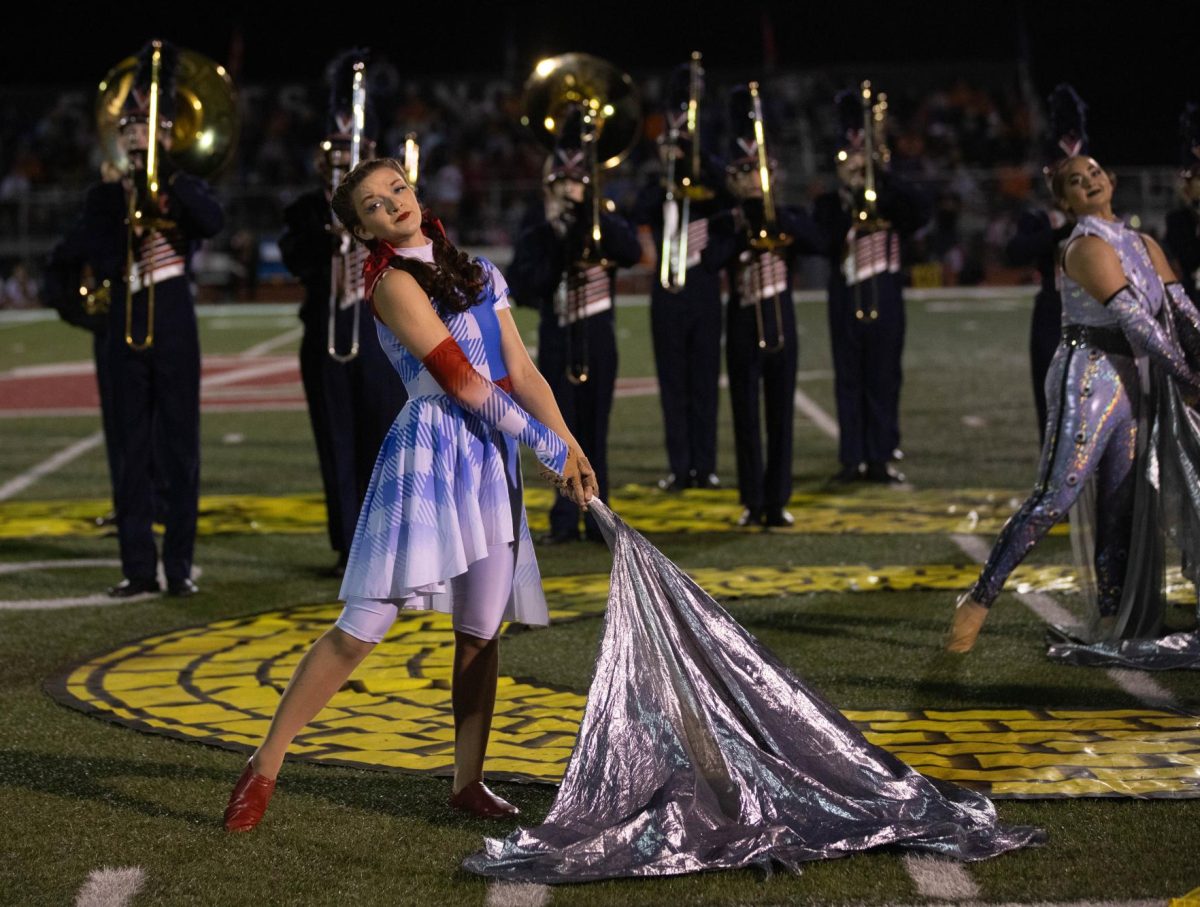 Senior Graycn Burke portrays Dorthy in the Liberty Color Guards fall halftime performance.