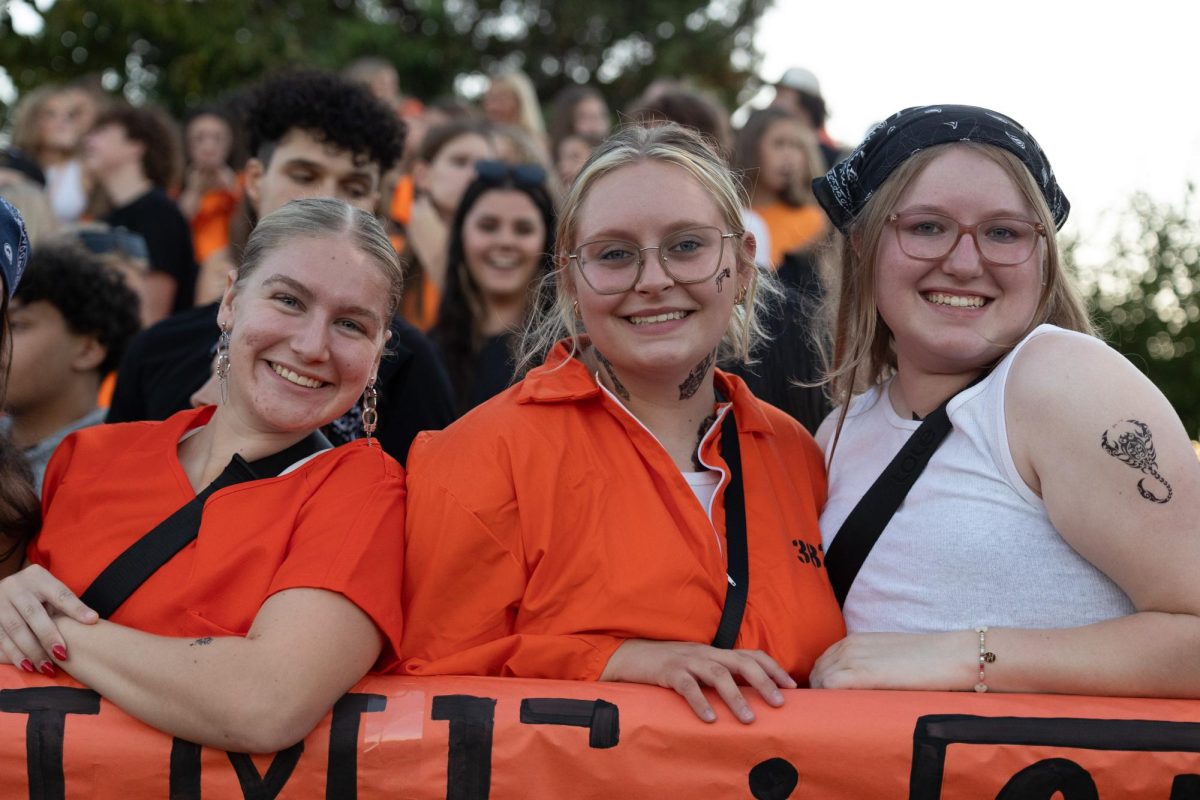 Grace dressed in her best jailbreak outfit in the student section during the varsity football game against Holt.