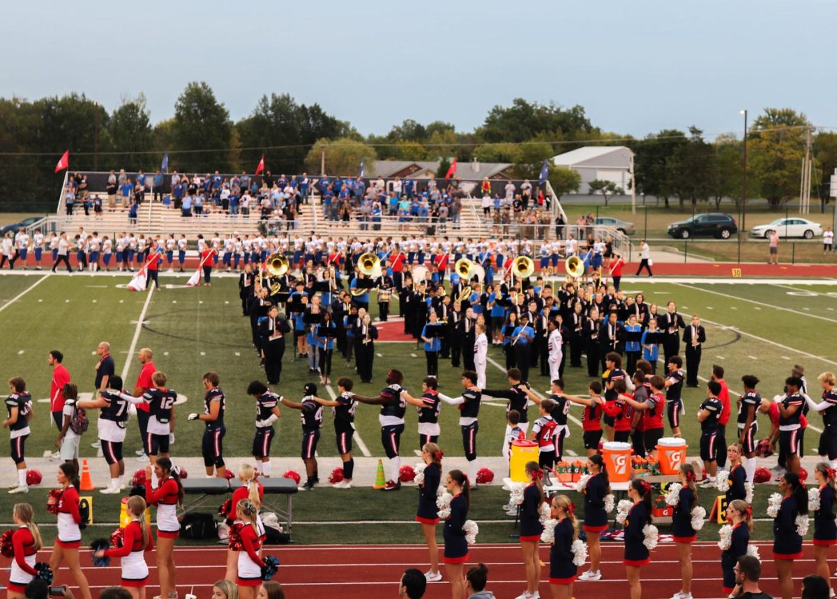 Frontier 8th grade band performs national anthem and fight song with Liberty Regiment 