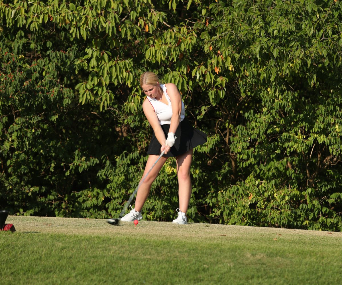 Catherine Paige tees the golf ball off on a hole at the Links at Dardenne on Sept. 25 against Howell North.