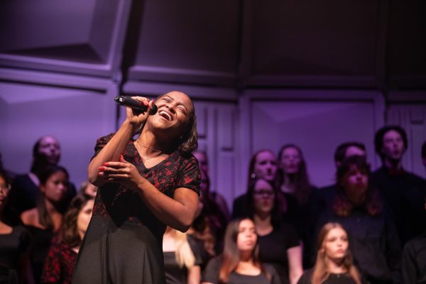Senior Grace Edney performs her solo during The Storm is Passing Over arranged by Charles Albert Tindley during the fall choir concert.