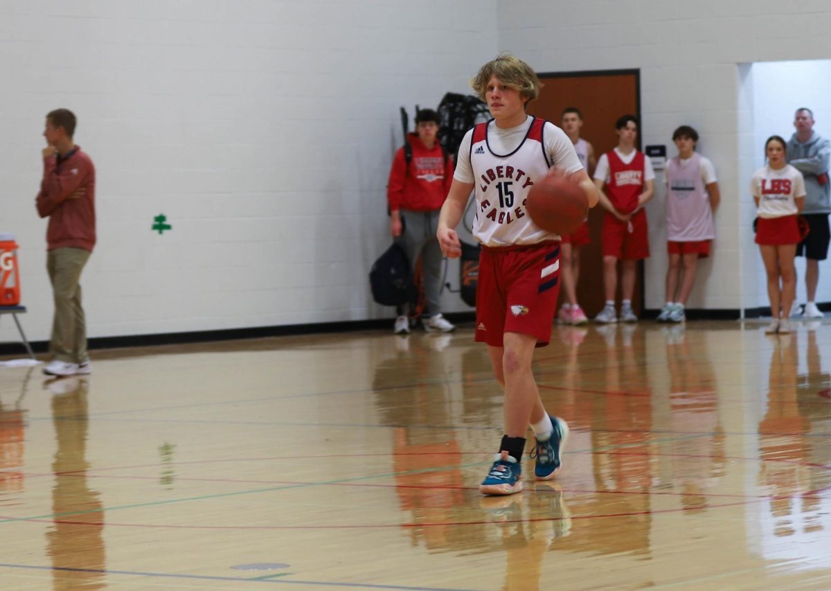 Noah Foelsch looks down the court in the first quarter against Lutheran.