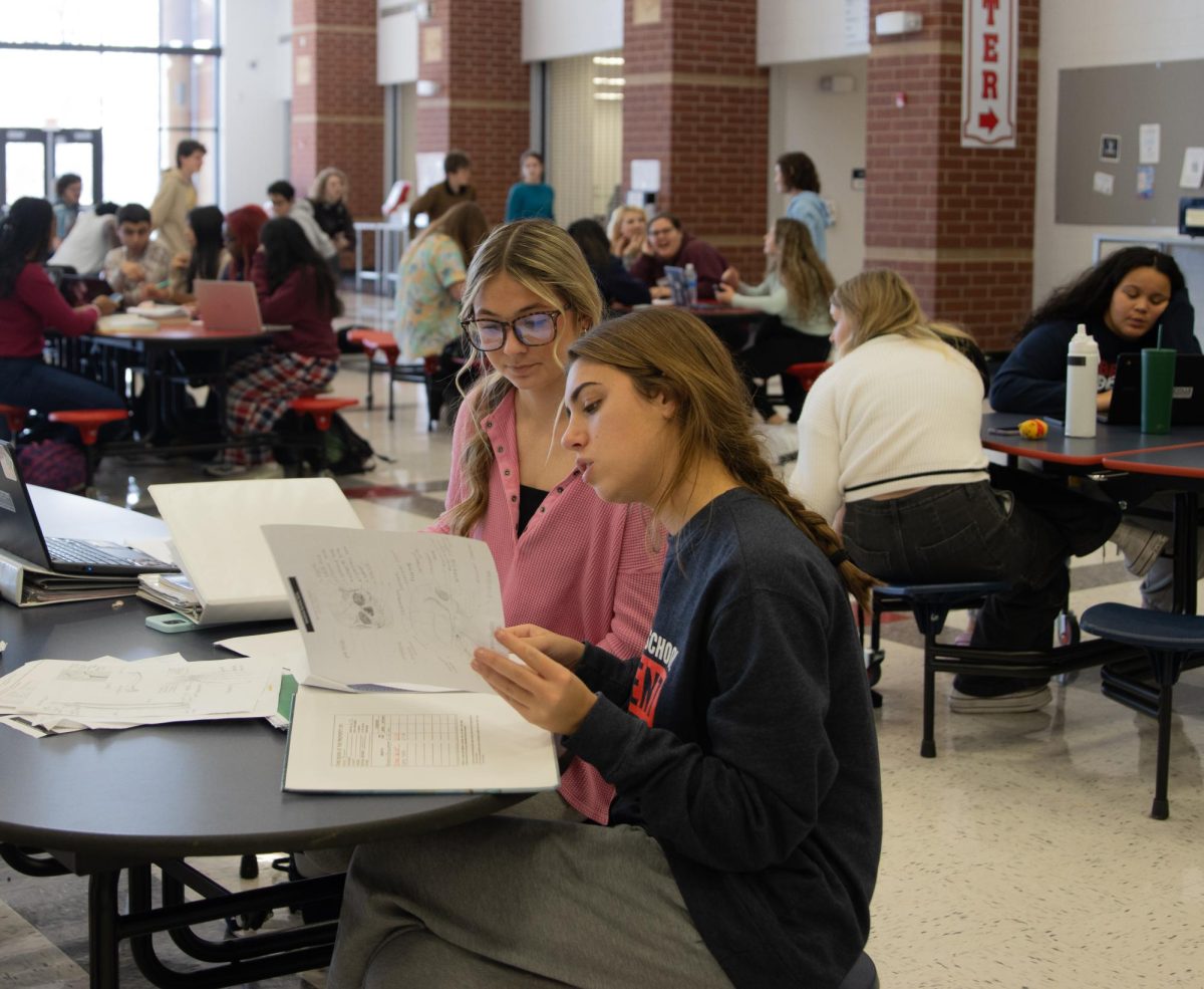 Senior Laney Torbit and junior Andrea Finkling study for finals during the Cookies, Cocoa, and Cram event.