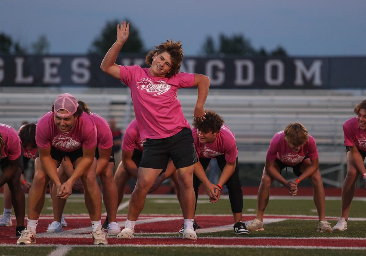 Senior Drew Smith, powderpuff coach, dances to Aquas Barbie Girl during the senior boys halftime routine. Hair flipping and arm switch-swinging, he proudly performs his solo. This is one of my favorite photos of all time because I remember this halftime dance being quite funny, so the camera went down and I enjoyed it thoroughly, only to put it back up and catch this speedy move through the viewfinder. 