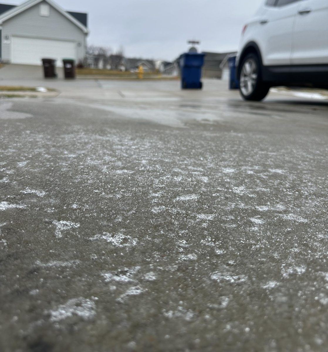 Ice coats the driveway and sidewalks Tuesday morning restricting travel on the west side of the district by NPHS and HOLT areas.