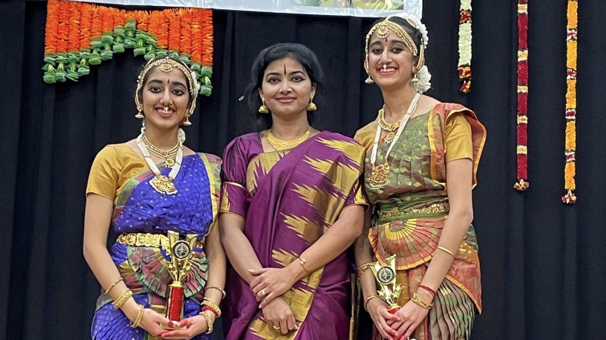 Rathi Thiagarajan (left), her current teacher Prathiba Mannil (center), and her sister Raksha (right). (submitted by Rathi Thiagarajan)