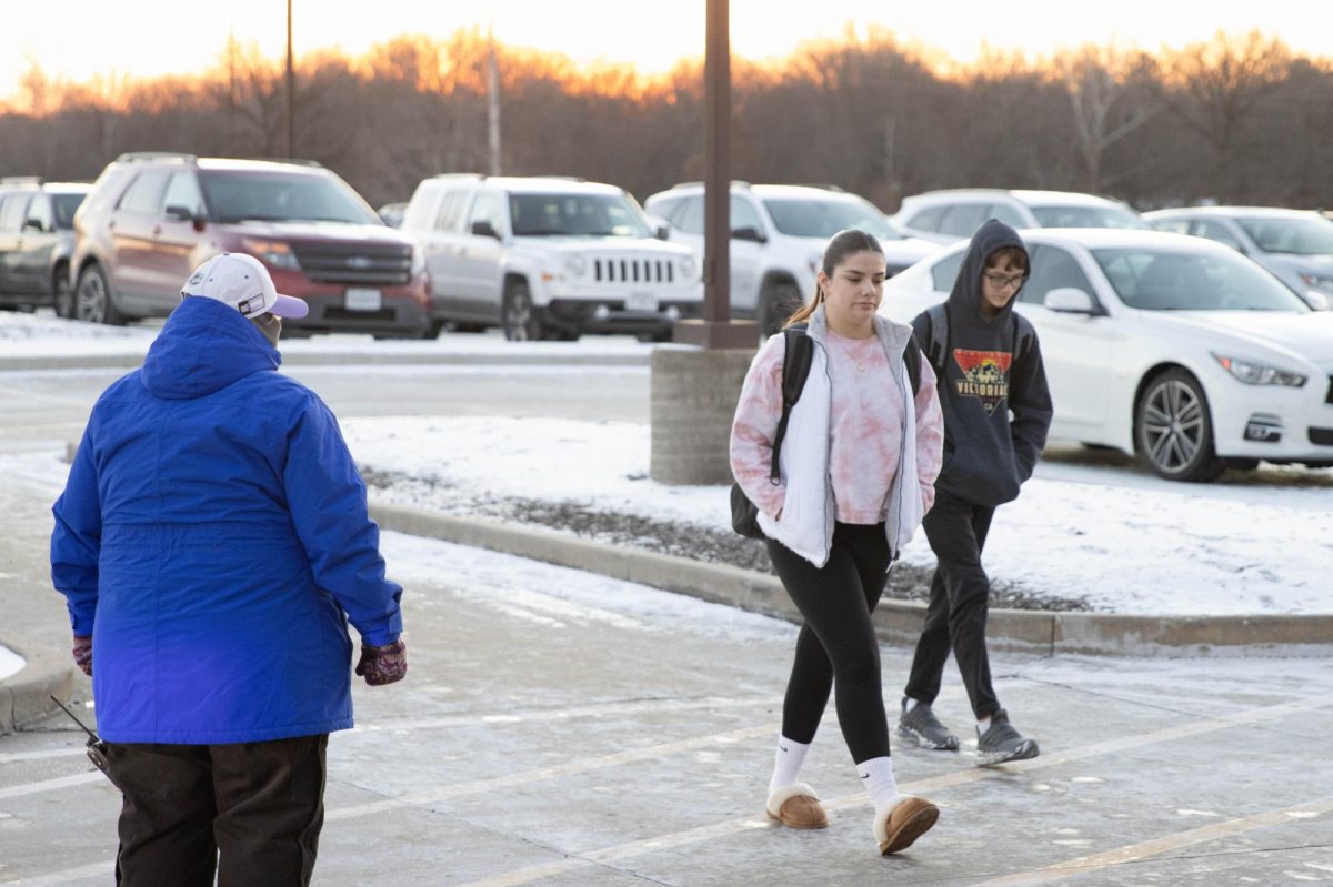 Following freezing temperatures, students walk back into school after the first snow day of the year. 