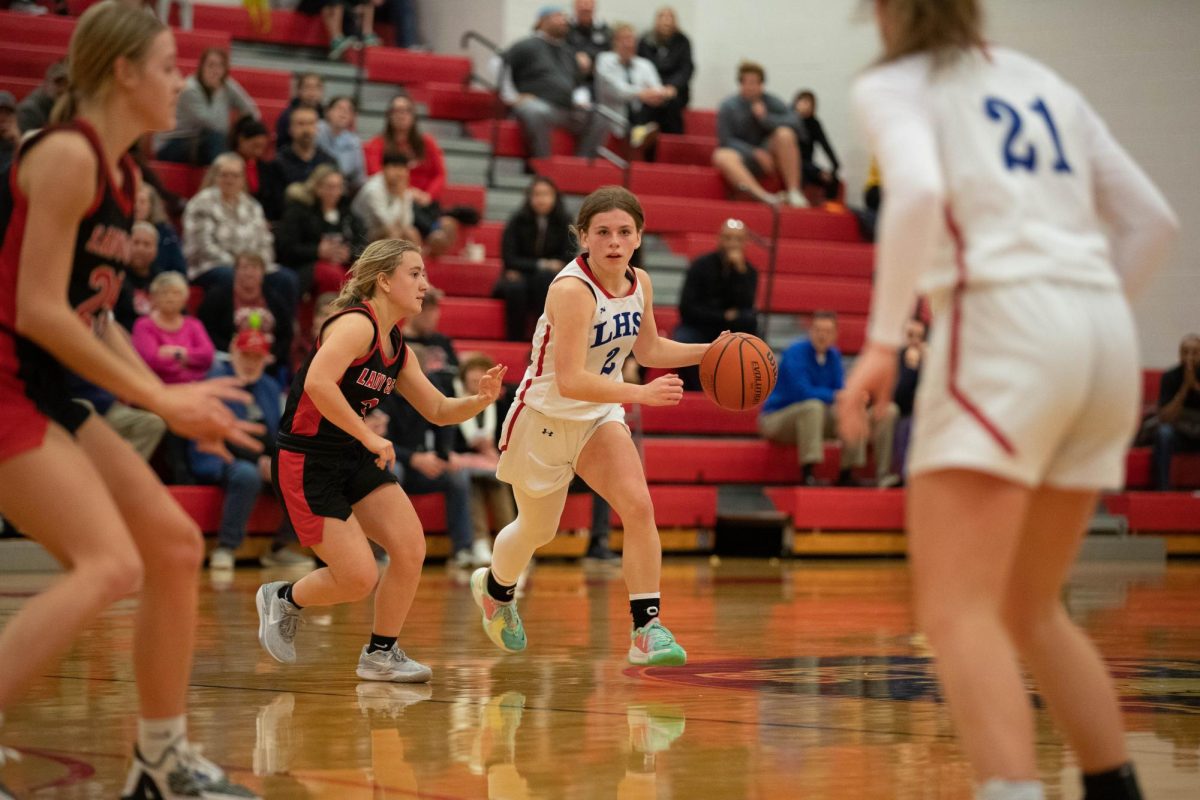 Sophomore point guard Melyna Warren dribbles the ball during a varsity game against Bowling Green on Dec. 13. This game ended in a win for the Eagles with a score of 37-35.