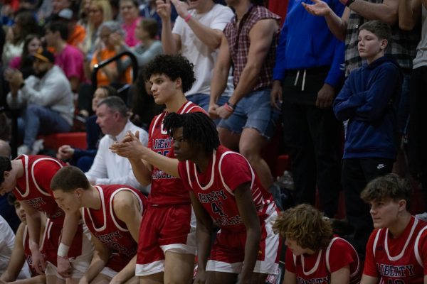 Senior Lincoln Rockette stands and cheers for his teammate after scoring a field goal into the hoop during a game against Fort Zumwalt South. 