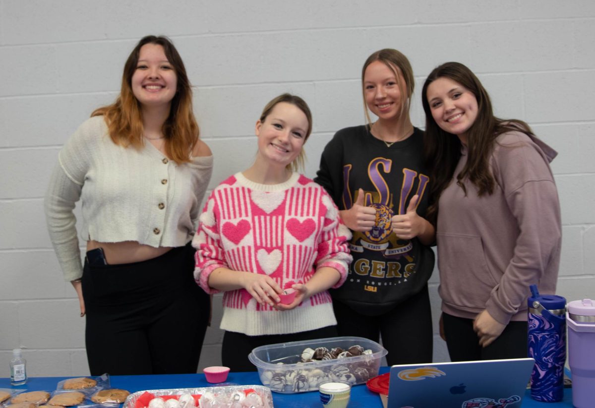Publications students Rylee Shipes, Lilly Brown, Amber Sethaler and Caitlin McDonnell sold dessert items on Valentines Day as part of a fundraiser for a trip to Kansas City later this spring. 