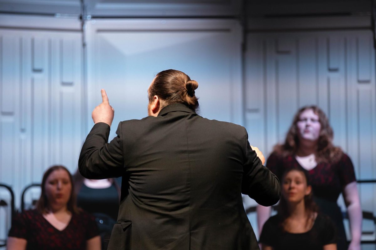 Choir teacher and music director Mr. Datz conducts the Select Treble Choir during their spring performance. The previous week, the Select Treble Choir got a gold rating at the small and large ensemble festival. 