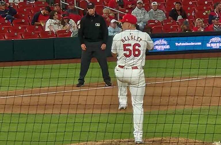 Cardinals relief pitcher Ryan Helsley is shown winding up for the pitch. You can see that the letters look abnormally small, and the MLB logo looks oddly placed.