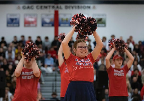 Sophomore Julia Miller performs a routine with the Liberty Spirit Squad during the annual Swofford game assembly, which was held on April 4 in the gymnasium. This is an annual fundraiser that provides  two $1,000 scholarships for two Liberty seniors. This game resulted in the staff members winning 41-26, continuing their winning streak.