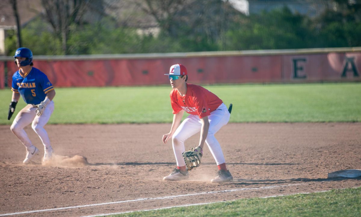 Freshman Ryan Dobratz prep steps at first base against Seck High School on Mar. 15.