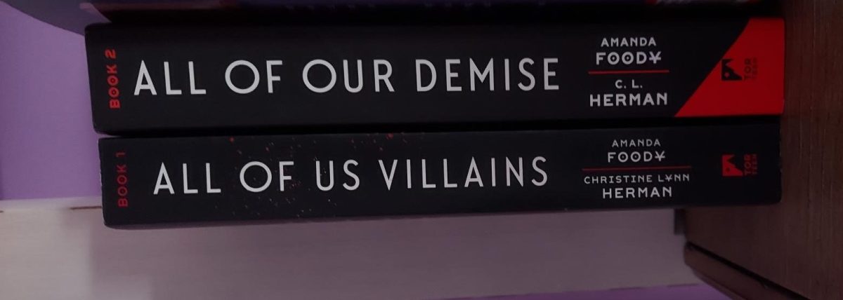 All+of+Us+Villains+and+All+of+Our+Demise+by+Amanda+Foody+and+C.+L.+Herman+sits+side-by-side+on+my+bookshelf.+