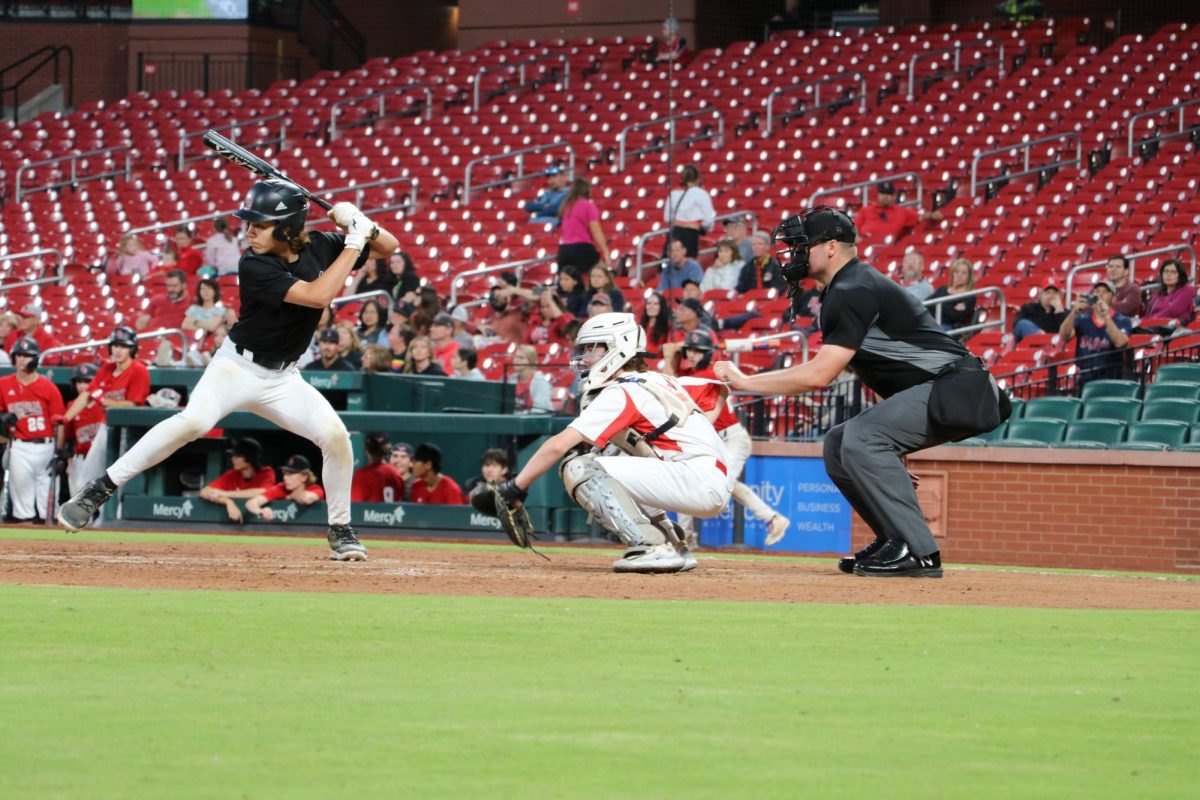 Freshman Connor Casella goes behind the plate for his first varsity catching experience. 