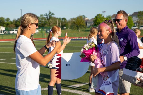 During the girls varsity senior night, senior Mia Knobbe gets honored by her friends, family members, and teammates, and receives a medal to commemorate her hard work and effort over the years. Knobbe is continuing soccer after high school, and will be attending and playing for Kansas State University. 